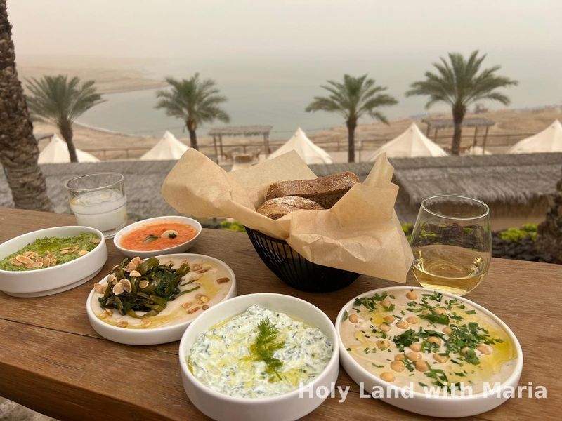 A mezze table looking out over the Dead Sea