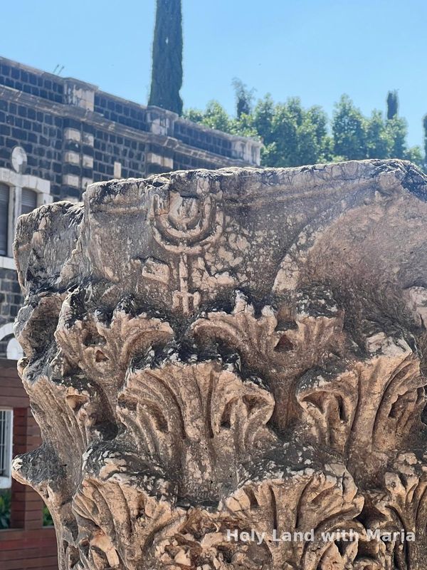 Carved capital with a menorah at Capernaum