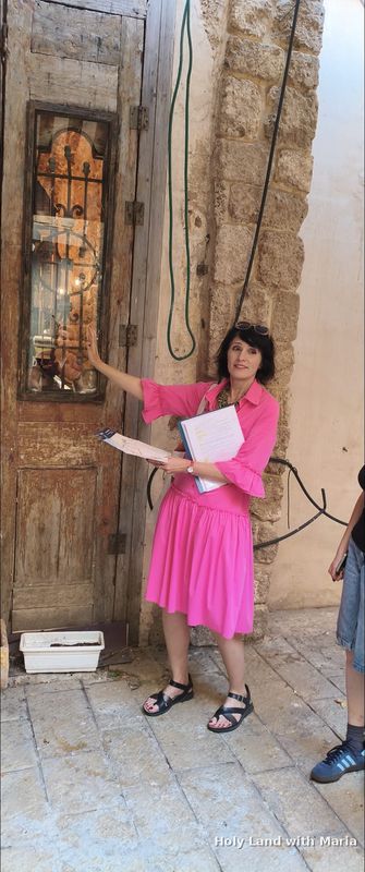 A bride photographed in an arched stone passage in Old Jaffa