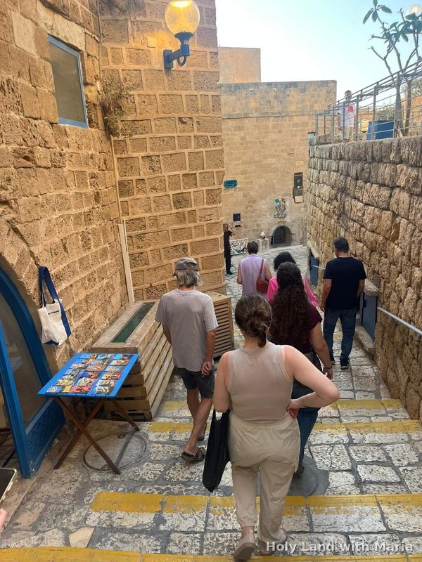 Stepped alley in Old Jaffa with an artist's stall