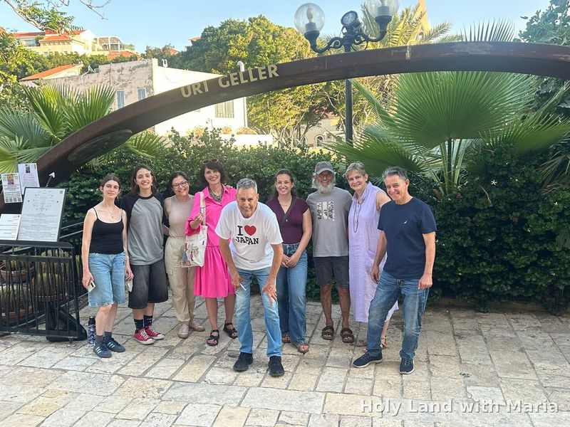 Tour group under the Uri Geller Museum arch in Old Jaffa