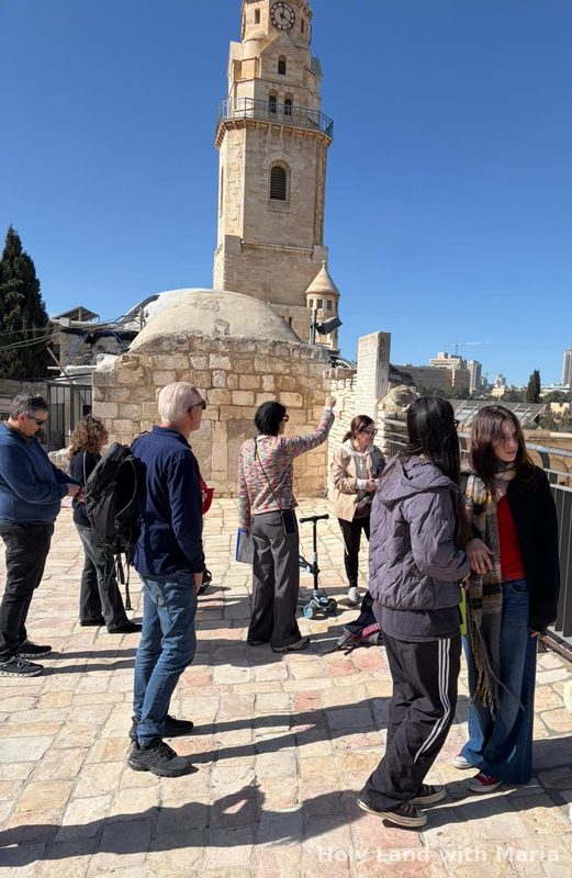 Maria Lando guiding a group on the roof above King David's Tomb and the Room of the Last Supper on Mount Zion, Jerusalem